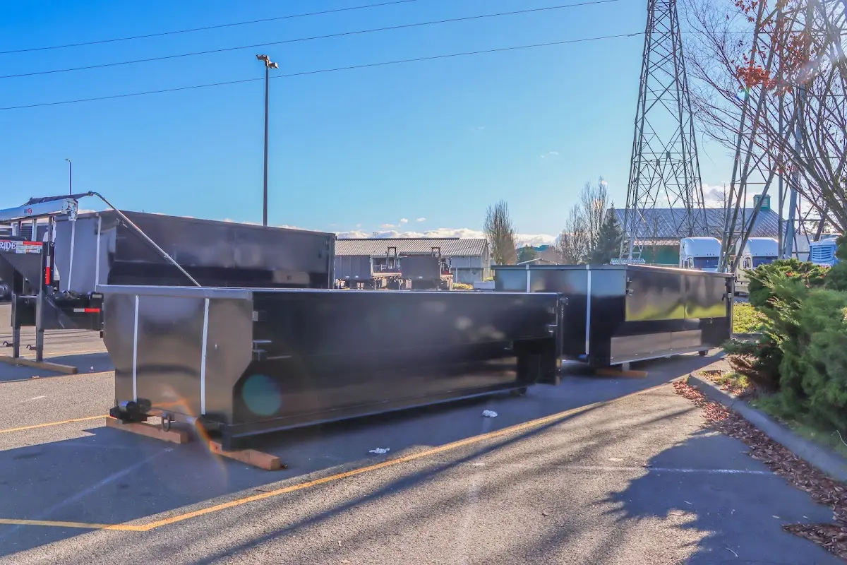 Roll-off dumpster ready for waste disposal at job site for Concrete Dumpster Rental in Ludlow
